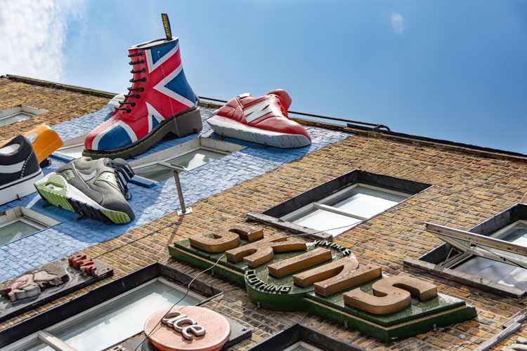 3D advertising on side of building with shoes