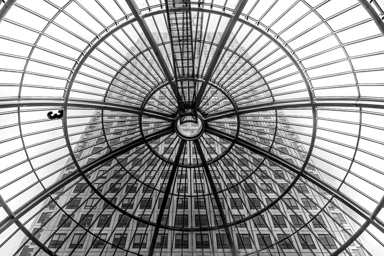 Roof of shopping centre looking up at Canary Wharf tower