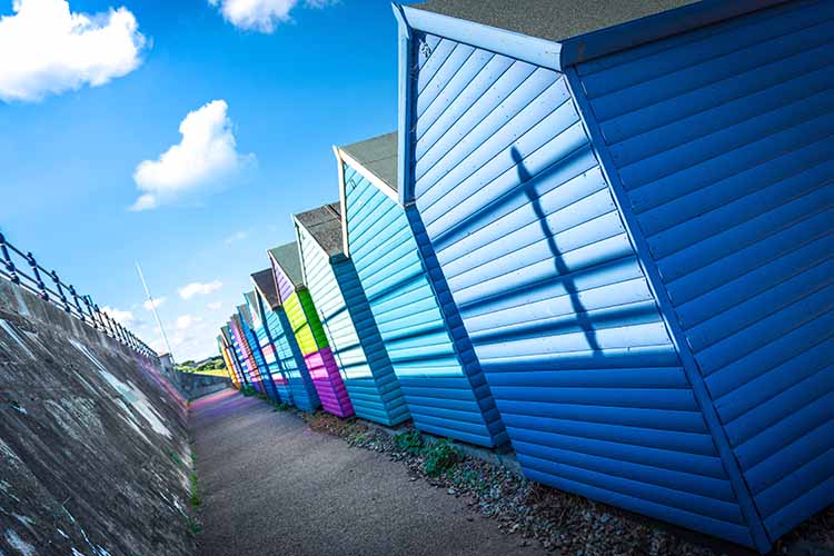 View of the colourful beach huts of Whitstable